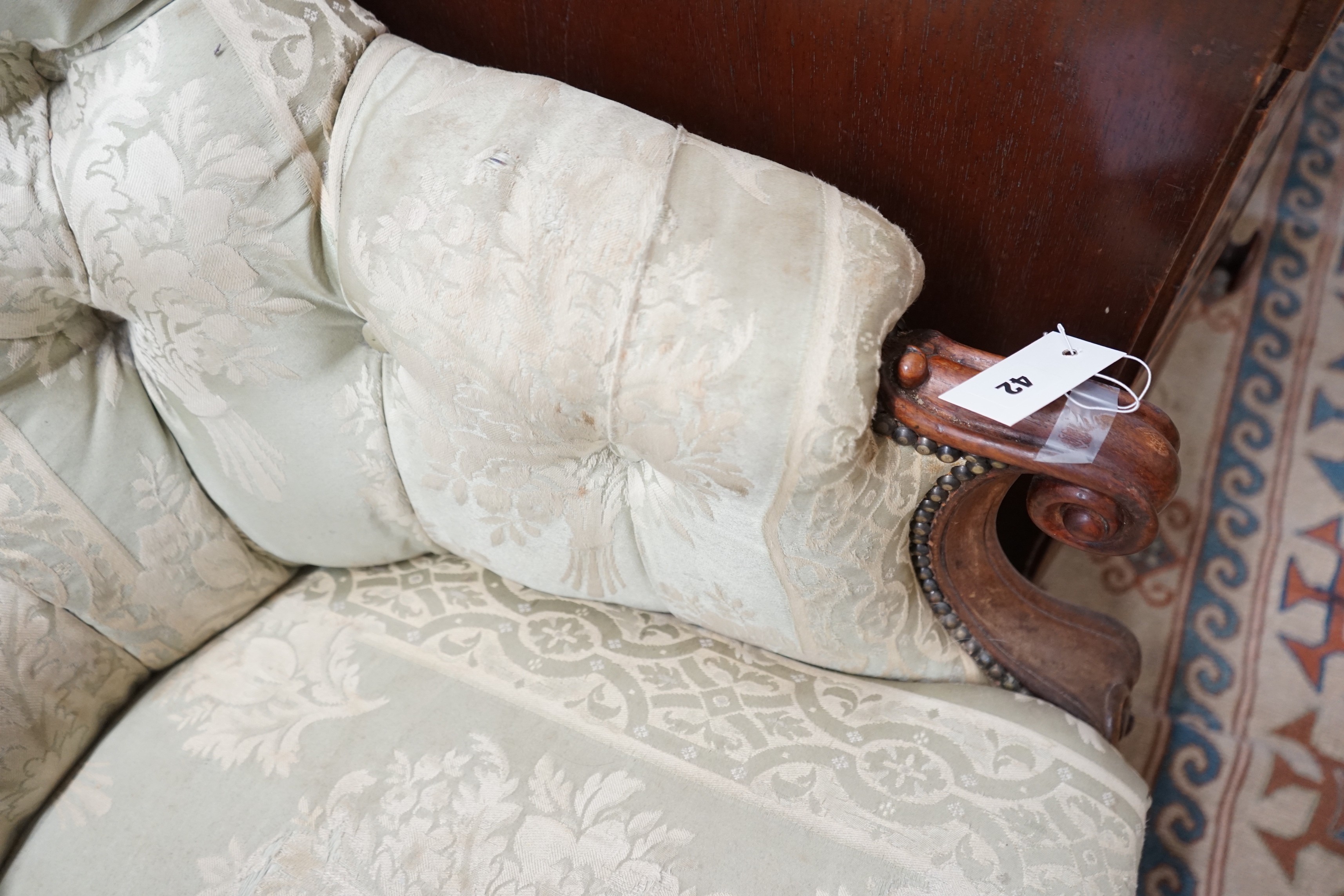 A Victorian rosewood upholstered spoon back armchair, width 66cm, depth 80cm, height 98cm